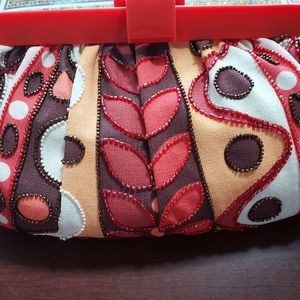 Isabella Fiore Wonen's beaded cotton hand clutch.